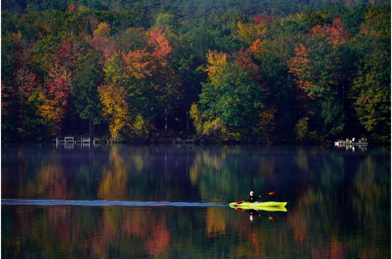Virginia Davidson of Bridgton, Maine, paddles her kayak on Moose Pond, Oct. 13, 2021, in Bridgton, Maine. Credit: AP Photo/Robert F. Bukaty Your latest prescription is to get outside